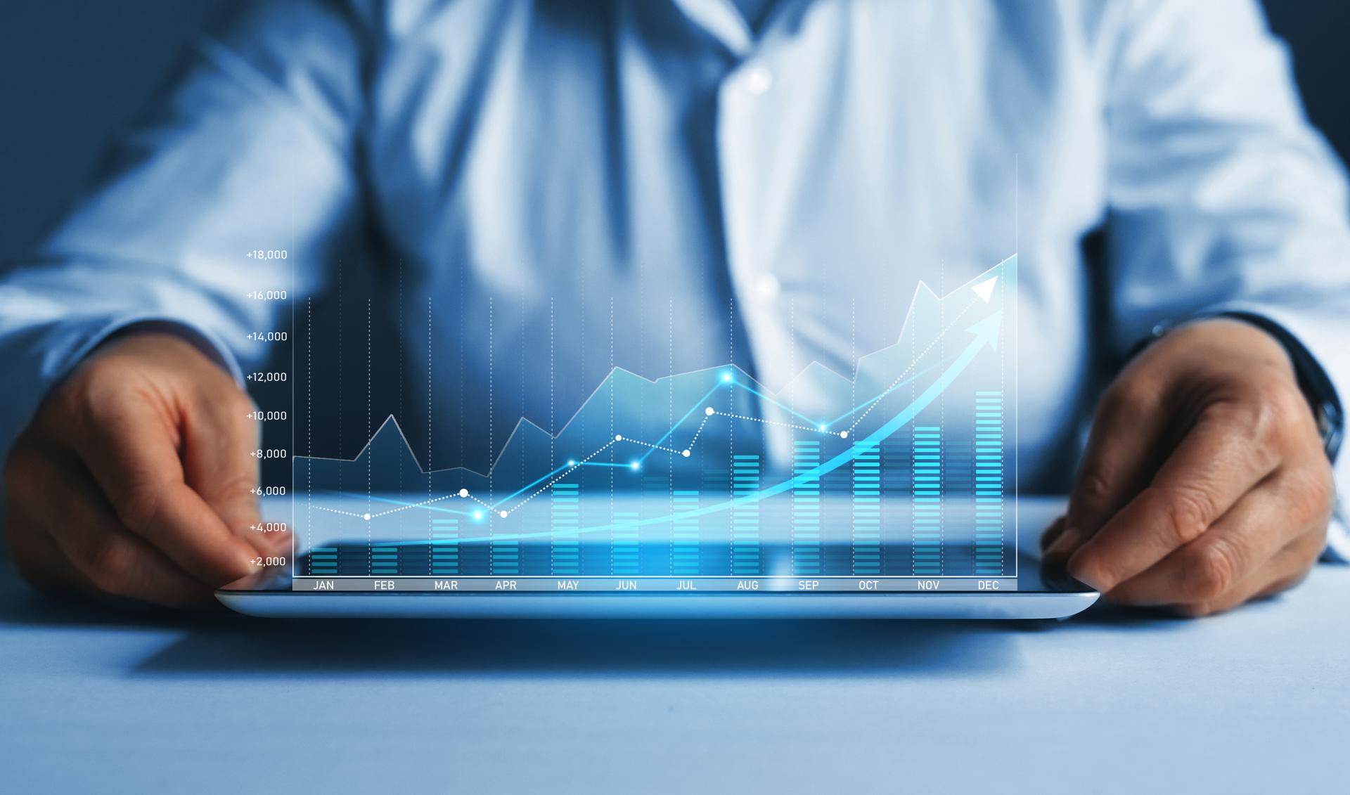 Business person analyzing financial annual statistics displayed on virtual  screen. Infographic annual statistics.
Growth the company's annual revenue to success.